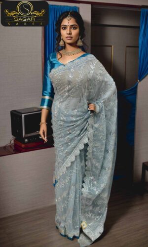 Women wearing light sky blue color chiffon saree