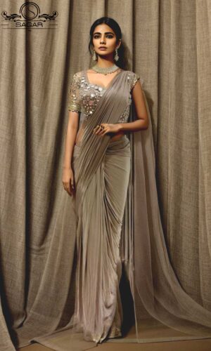 model wearing beige readymade saree
