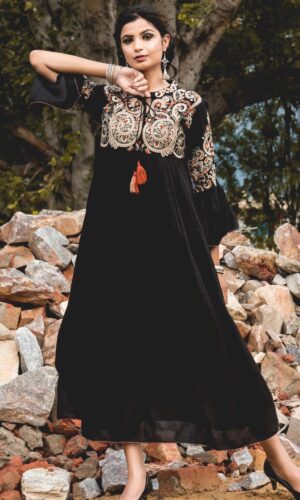 Image of a cotton dress with intricate embroidery, showcasing elegant design and craftsmanship.