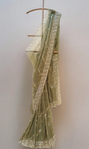 image of mehendi-colored saree with an intricately embroidered border.