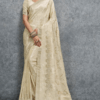 Elegant cream silk saree with woven jacquard floral motifs and rich border, paired with matching blouse, perfect for wedding, festive and party wear.