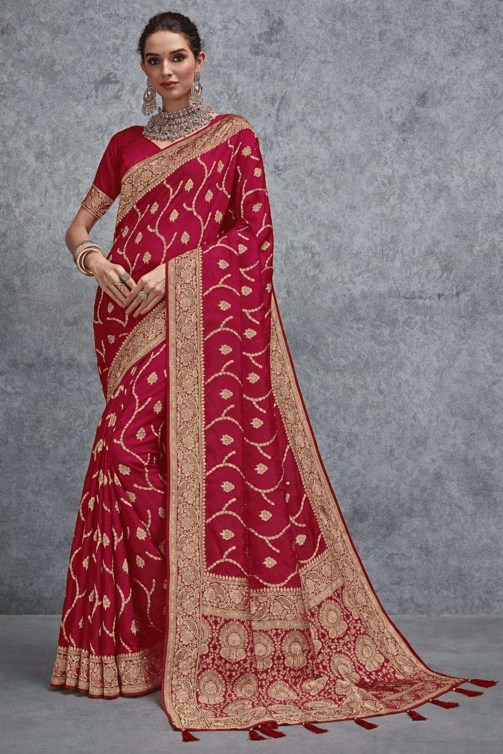Elegant red Banarasi silk saree with intricate gold zari weaving, wide traditional border and richly detailed pallu, ideal for wedding, bridal and festive occasions.