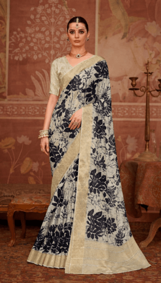 Model wearing an ivory silk saree with bold black floral prints and gold zari border.