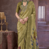 olive green Chinon silk saree with floral digital print and rich woven border, styled with traditional jewelry, perfect for festive and wedding occasions.