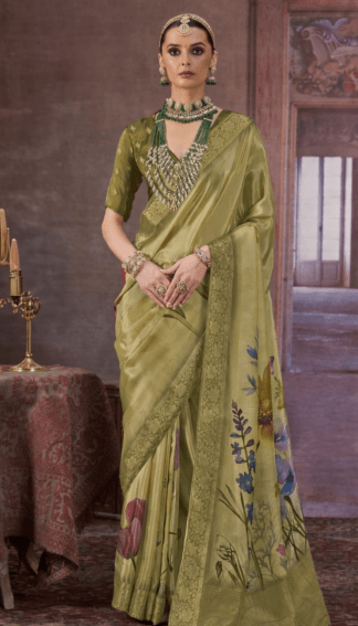 olive green Chinon silk saree with floral digital print and rich woven border, styled with traditional jewelry, perfect for festive and wedding occasions.