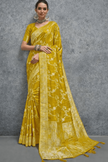 Elegant mustard yellow Banarasi silk saree with intricate floral zari weaving and rich traditional border, perfect for wedding, festive and party wear occasions.