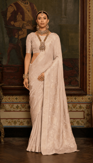 Ivory pink silk saree with self-tone floral zari weave and soft shimmer finish