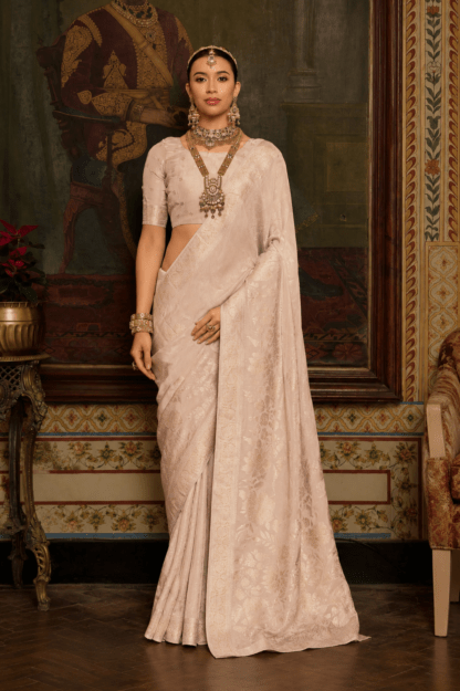 Ivory pink silk saree with self-tone floral zari weave and soft shimmer finish