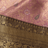Pink Kanchipuram silk saree with gold zari paisley and floral motifs, contrast border and pallu
