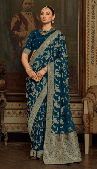 Teal blue silk saree with gold zari paisley and vine embroidery, heavy woven border