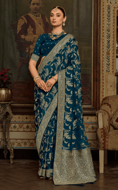 Teal blue silk saree with gold zari paisley and vine embroidery, heavy woven border