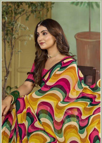 Woman seated in multicolor abstract wave print georgette saree with pink blouse and sequin border