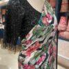 Close-up of lotus floral print saree pallu with black sequin blouse neckline embroidery