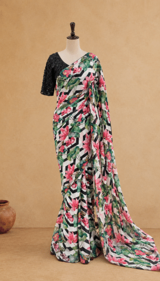 Full-length black and white lotus print designer saree draped on mannequin with tasseled sequin blouse