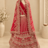 Full view of red bridal lehenga with heavy embroidery and matching scalloped net dupatta on mannequin