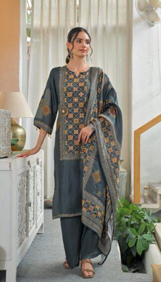 Woman wearing grey geometric mirror work kurti palazzo set with mandala print dupatta