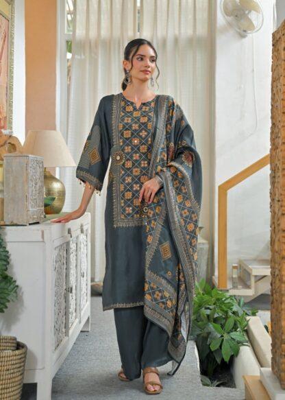 Woman wearing grey geometric mirror work kurti palazzo set with mandala print dupatta