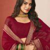 Woman wearing maroon chiffon saree with golden zari border and matching blouse