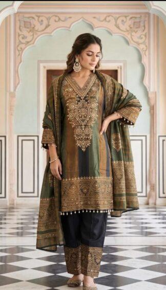 Model wearing mustard-olive striped silk suit set with embroidered dupatta and black pants, festive ethnic wear