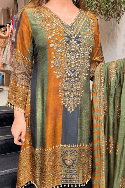 Close-up of mustard green and black striped silk kurti with gold mirror-work embroidery on neckline and hem