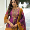 Woman wearing purple and mustard chevron print kurti palazzo set with embroidered neckline and matching dupatta