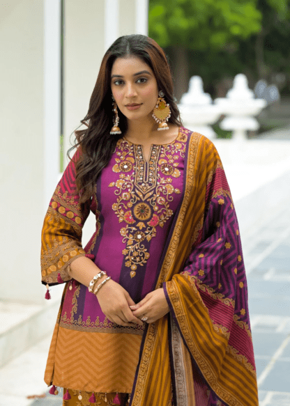 Woman wearing purple and mustard chevron print kurti palazzo set with embroidered neckline and matching dupatta
