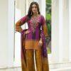 Woman wearing purple and mustard chevron print kurti palazzo set with embroidered neckline and matching dupatta
