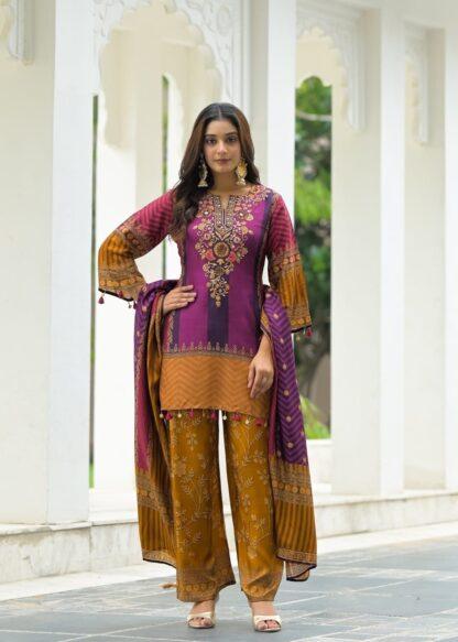 Woman wearing purple and mustard chevron print kurti palazzo set with embroidered neckline and matching dupatta