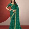 Woman wearing emerald green chiffon saree with golden zari border and matching blouse