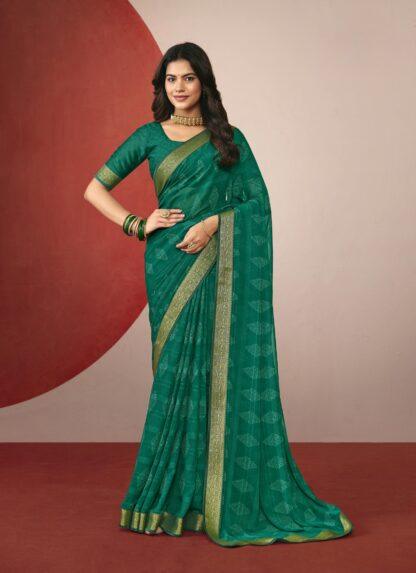 Woman wearing emerald green chiffon saree with golden zari border and matching blouse