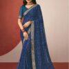 Woman wearing navy blue chiffon saree with abstract geometric print and golden zari border