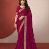 Woman wearing rani pink chiffon saree with golden zari border and matching blouse