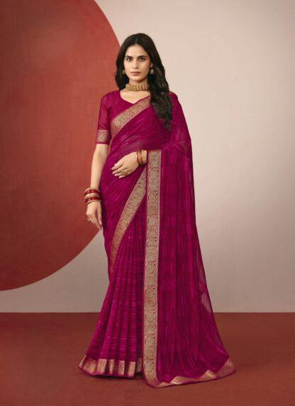 Woman wearing rani pink chiffon saree with golden zari border and matching blouse