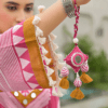 Woman wearing rani pink polka dot print cotton kurti palazzo set with mirror work neckline