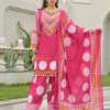 Woman wearing rani pink polka dot print cotton kurti palazzo set with mirror work neckline