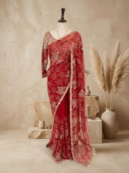 Red embroidered net saree with rose sequin work and scalloped border on mannequin